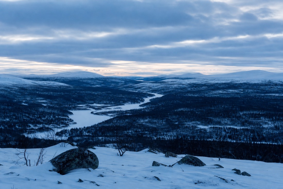 Blue hour over a Lapland valley, snow holding the last light